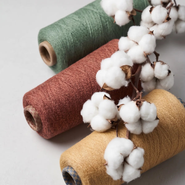 Discover the natural materials and craftsmanship behind Yanng's premium yarn spools.