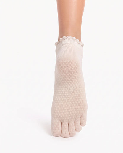 Bottom view of Yanng's Full Toe Ruffle Open-Vamp Low Rise Grip Socks showing the precision 3D transparent non-slip grip sole