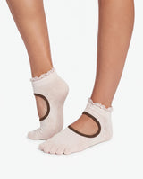 Close-up of model's feet showcasing Yanng's Full Toe Ruffle Open-Vamp Low Rise Grip Socks with delicate ruffle trim and open-vamp design