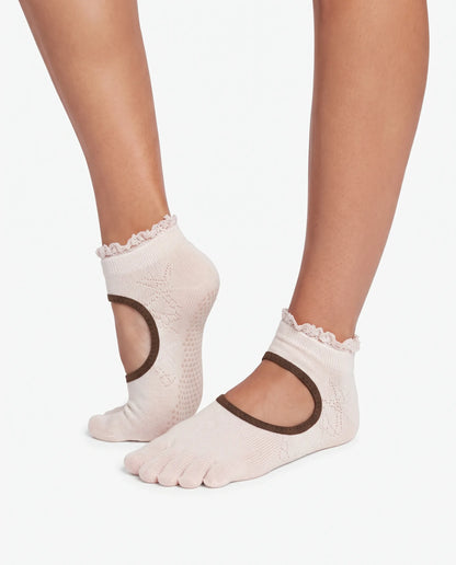 Close-up of model's feet showcasing Yanng's Full Toe Ruffle Open-Vamp Low Rise Grip Socks with delicate ruffle trim and open-vamp design
