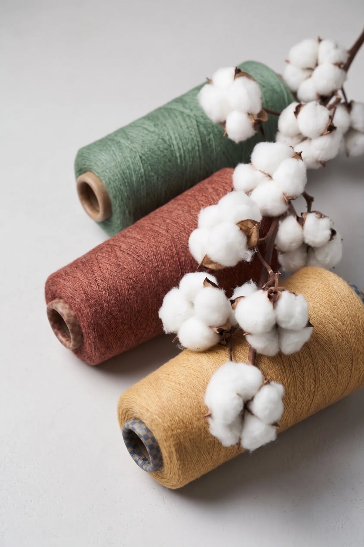 Discover the natural materials and craftsmanship behind Yanng's premium yarn spools.